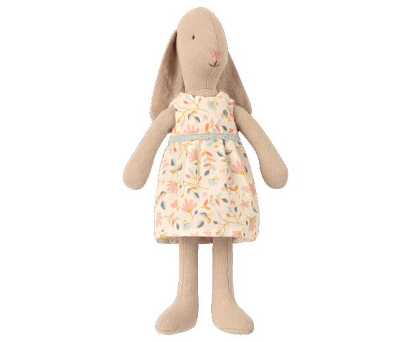 Stuffed animals positioned in a child's Maileg Bunny with Dress, Size 1 Dollhouse Toy setting with a miniature lamp and crib.