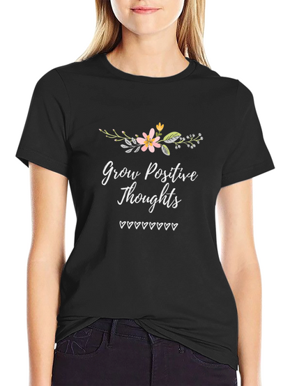 Camiseta Negra con Diseño Floral y Mensaje Positivo